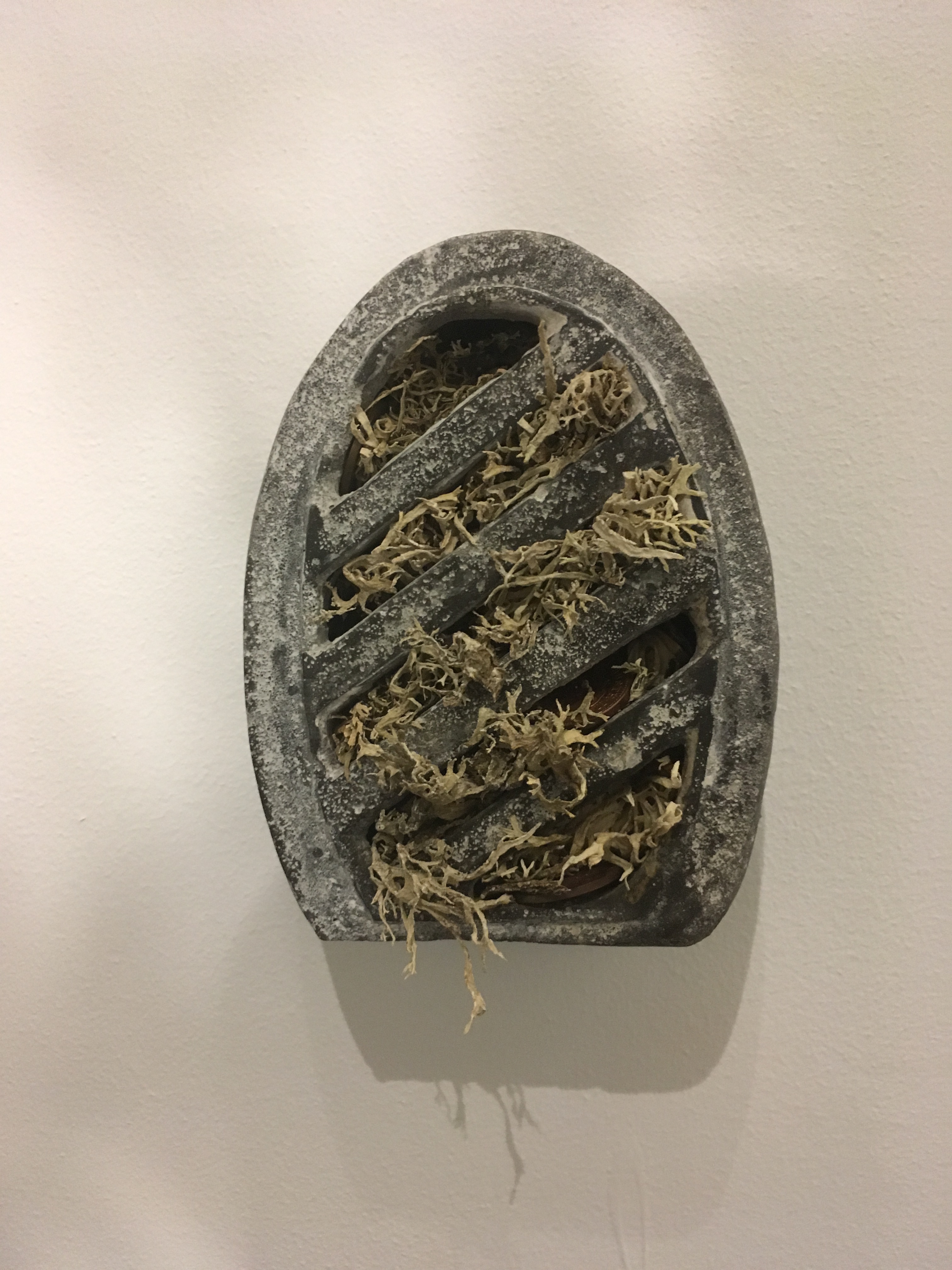 Victoria Adam: Wholemeal breeze (oakmoss / copper / Coke) (2018) Aluminous cement, oakmoss, 16p in 1p coins, Coca-Cola; 12 x 9.5 x 6cm. at Lungley Gallery, London.