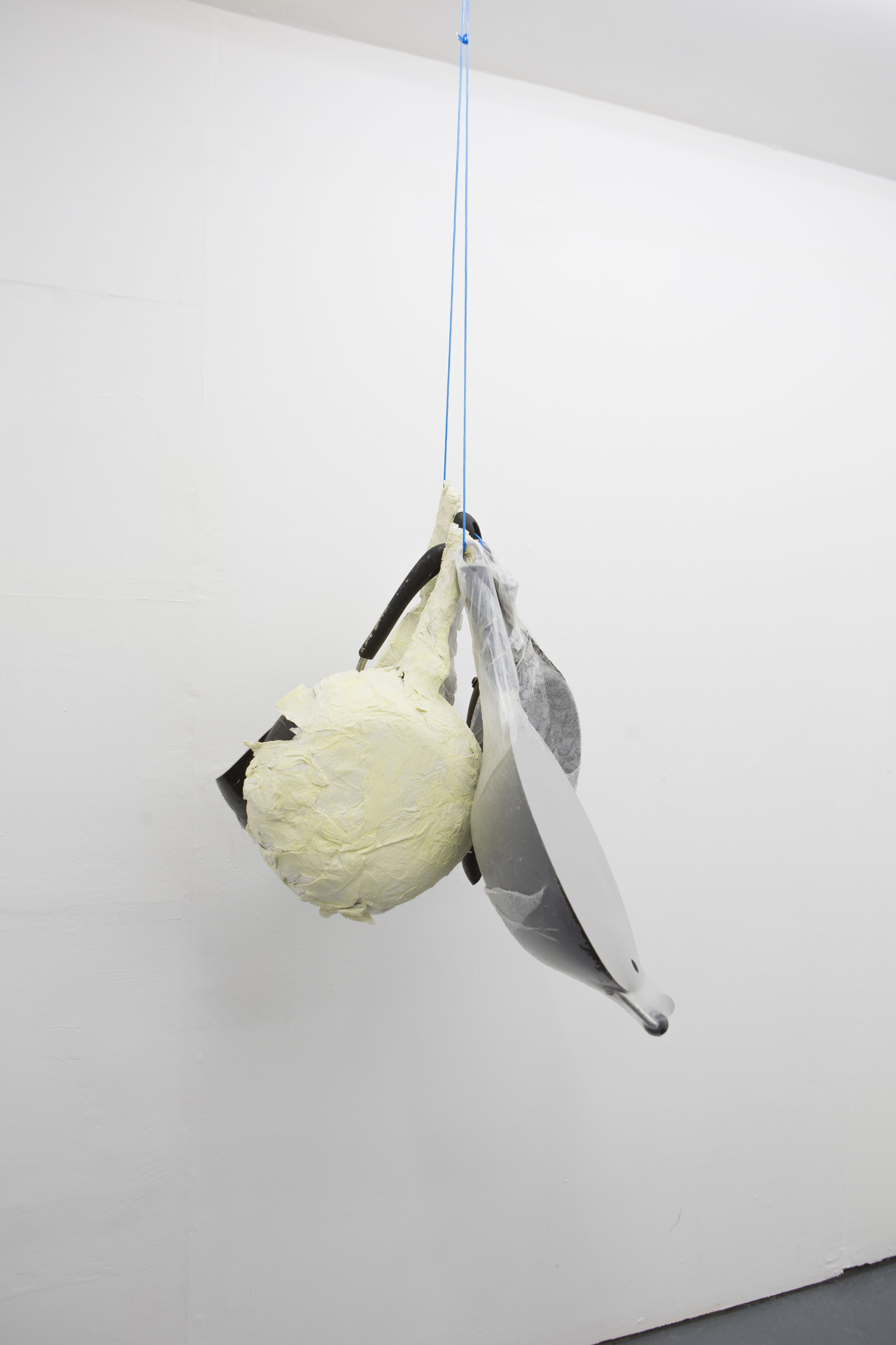 Thomas Greig Frying pans (2018); Dimensions variable; Frying pans, dust, plastic, tissue, acrylic paint, wire.